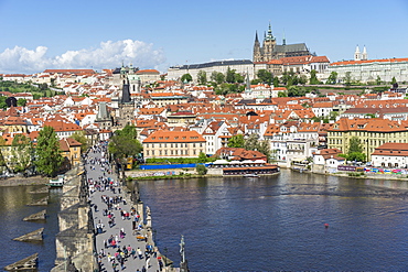 High angle view of Charles Bridge looking towards the Castle District, Royal Palace and St. Vitus's Cathedral, UNESCO World Heritage Site, Prague, Czech Republic, Europe