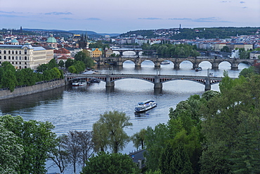 Prague cityscape looking down the Vltava River at its bridges connecting the Old Town to Mala Strana, Prague Castle and Hradcany, Prague, Czech Republic, Europe