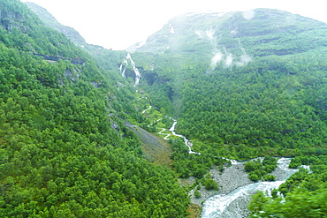 A view of waterfalls and forest from the Flam Railway, Flamsbana, Flam, Norway, Scandinavia, Europe