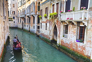 A gondola on a canal in Venice, UNESCO World Heritage Site. Veneto, Italy, Europe