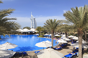 Burj Al Arab seen from the swimming pool of the Madinat Jumeirah Hotel, Jumeirah Beach, Dubai, United Arab Emirates, Middle East