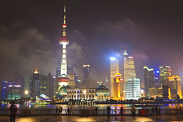 Pudong skyline at night across the Huangpu River, Oriental Pearl tower on left, Shanghai, China, Asia