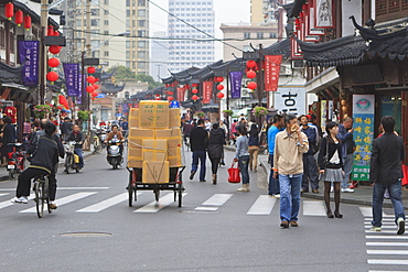 Pedestrians and traffic on Shanghai Old Street, remnant of a bygone age, Fuxing, Shanghai, China, Asia