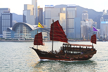 Chinese junk boat sails on Victoria Harbour, Hong Kong, China, Asia