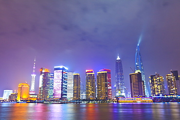 Pudong skyline at night across the Huangpu River, Shanghai, China, Asia