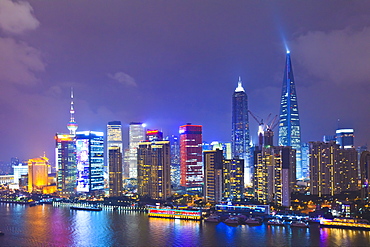 Pudong skyline at night across the Huangpu River, Shanghai, China, Asia