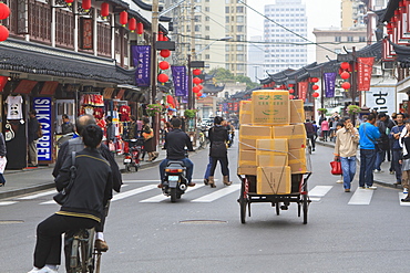 Pedestrians and traffic on Shanghai Old Street, a restored traditional neighbourhood, Nanshi, Shanghai, China, Asia