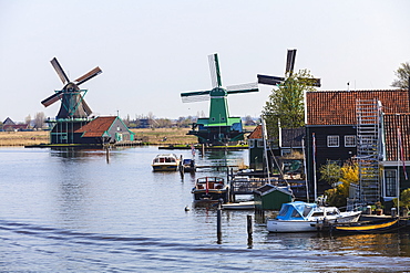 Preserved historic windmills and houses in Zaanse Schans, a village and working museum on the banks of the river Zaan, near Amsterdam, Zaandam, North Holland, Netherlands, Europe