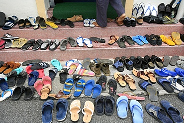 Shoes outside mosque during Friday prayers, Masjid Kampung Mosque, Kuala Lumpur, Malaysia, Southeast Asia