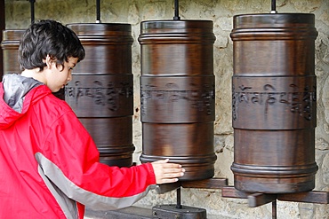 Prayer wheels in Dhagpo Kagyu Ling Tibetan Buddhist monastery, Saint-Leon sur Vezere, Dordogne, France, Europe