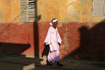 Woman walking in street, St. Louis, Senegal, West Africa, Africa