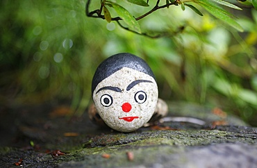 Painted stone used in shamanist rituals, Seoul, South Korea, Asia