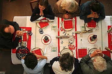 Family prayer before meal, Montrouge, Hauts de Seine, France, Europe