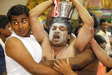 Entranced Hindu devotee restrained, London, England, United Kingdom, Europe