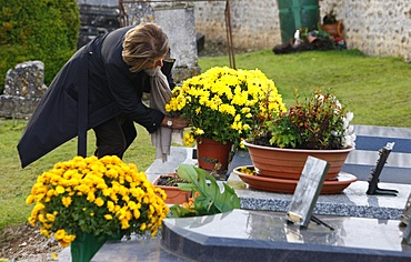 Woman in cemetery, Saint-Antonin-de-Sommaire, Eure, France, Europe