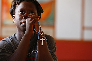 Christian woman praying, Togoville, Togo, West Africa, Africa