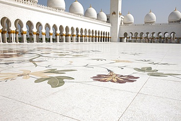 Colored floral marble and mosaics used as paving in the courtyard of 17,000 square metres, Sheikh Zayed Grand Mosque, Abu Dhabi, United Arab Emirates, Middle East