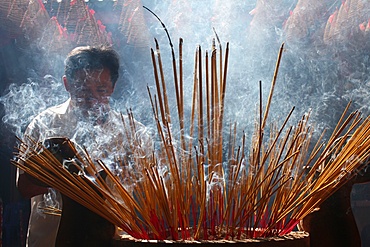 Burning incense during Tet, the Vietnamese lunar New Year celebration, Quan Am Pagoda, Ho Chi Minh City, Vietnam, Indochina, Southeast Asia, Asia