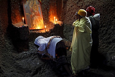 Women praying in Bet Medhane Alem church in Lalibela, Wollo, Ethiopia, Africa