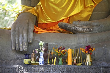 Buddha statue in earth-touching pose, with offerings, Siem Reap, Cambodia, Indochina, Southeast Asia, Asia