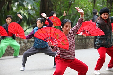 Tai-chi exercises with fans, Macau, China, Asia