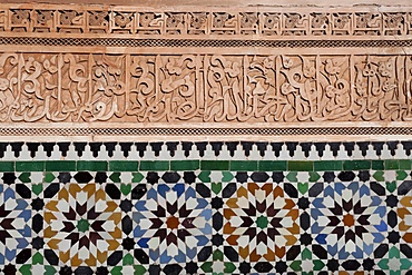 Calligraphy and zellige in the patio of the Medersa Ben Yousef, built in 1570, the biggest Koranic school in the Maghreb, Marrakesh, Morocco, North Africa, Africa