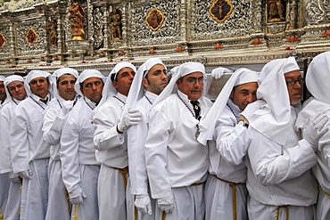 Nazarenos carrying the Rocio float during Easter week procession, Malaga, Andalucia, Spain, Europe