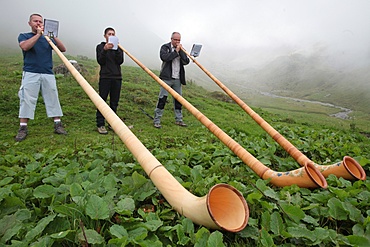 Horn blowers in the French Alps, Doran, Haute-Savoie, France, Europe