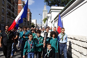 Muslim scouts carrying a torch outside the Paris Great Mosque, Paris, France, Europe