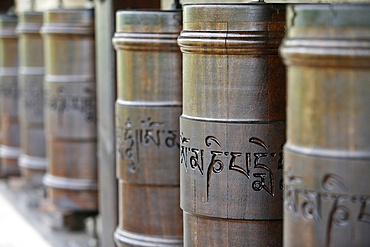 Prayer wheels in Dhagpo Kagyu Ling Tibetan Buddhist monastery, Saint-Leon sur Vezere, Dordogne, France, Europe