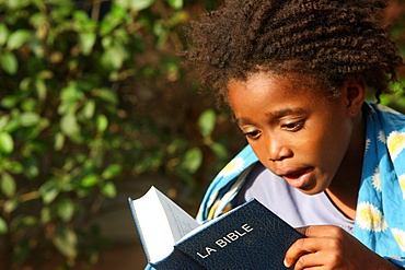 Father and daughter reading the Bible, Lome, Togo, West Africa, Africa