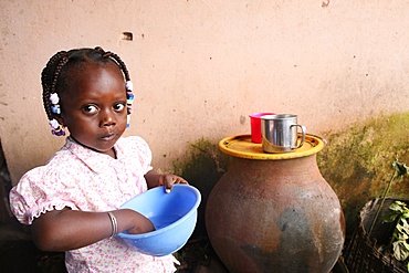 Girl eating a meal, Lome, Togo, West Africa, Africa