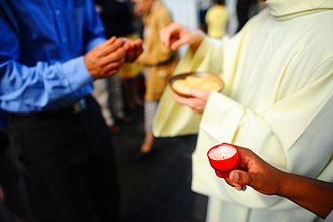 Catholic priest giving Holy Communion, Paris, France, Europe