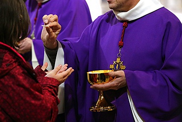 Holy Communion, Notre Dame Cathedral. Catholic Mass, Paris, France, Europe