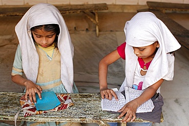 Girls learning Arabic in a medersa (koranic school), Fatehpur Sikri, Uttar Pradesh, India, Asia