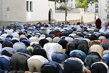 Muslims praying outside the Paris Great Mosque on Eid al-Fitr festival, Paris, France, Europe