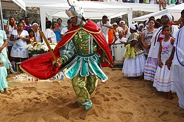 Entranced devotee embodying orixa Oxosse during Lemnaja festival on Rio Vermelho beach, Salvador, Bahia, Brazil, South America