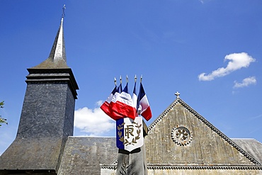 Church and French flags, Notre Dame du Hamel, Eure, France, Europe