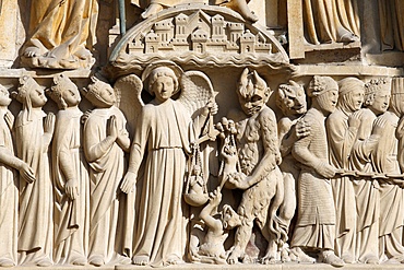 St. Michael weighing the souls, Portal of the Last Judgement, Western facade, Notre Dame de Paris Cathedral, Paris, France, Europe