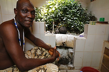 Voodoo priest Emile Vignikin in Tron Pitourika temple in Ouidah, Benin, West Africa, Africa