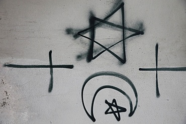 Religious symbols tagged on a wall, Montrouge, Hauts-de-Seine, France, Europe