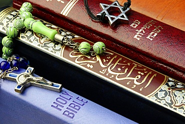 Bibles and Quran, interfaith symbols of Christianity, Islam and Judaism, the three monotheistic religions, Haute-Savoie, France, Europe