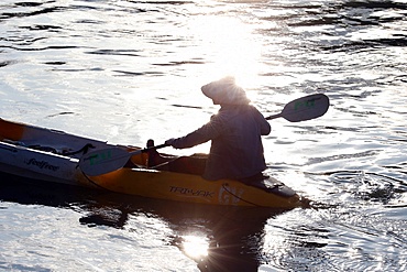 Man kayaking on the Nam Song River, Vang Vieng, Vientiane Province, Laos, Indochina, Southeast Asia, Asia