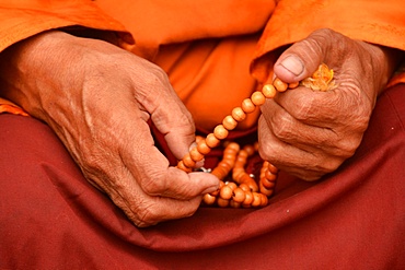 Tibetan monk holding prayer beads, Nepal, Asia