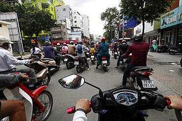 Vietnamese people on motorbikes in traffic, Ho Chi Minh City, Vietnam, Indochina, Southeast Asia, Asia