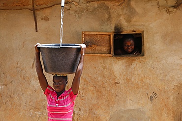 Collecting water in a Zou province village, Benin, West Africa, Africa