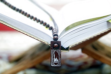 Holy Quran and Muslim prayer beads on wood stand, Hanoi, Vietnam, Indochina, Southeast Asia, Asia