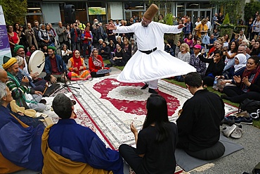 Whirling Dervish at gathering of Zen Buddhists and Muslim Sufis praying and celebrating together at the Salon Zen, Paris, France, Europe