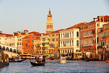 Gondolier on gondola on Grand Canal at sunset, Venice, UNESCO World Heritage Site, Veneto, Italy, Europe