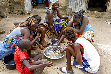 Family sharing a meal in a village near Fatick, Senegal, West Africa, Africa